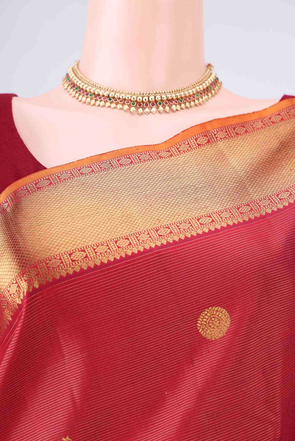 Border image of Pure Silk Pure Zari Maroon Kanjivaram Saree with Zari Butta on the body and Zari Border. 