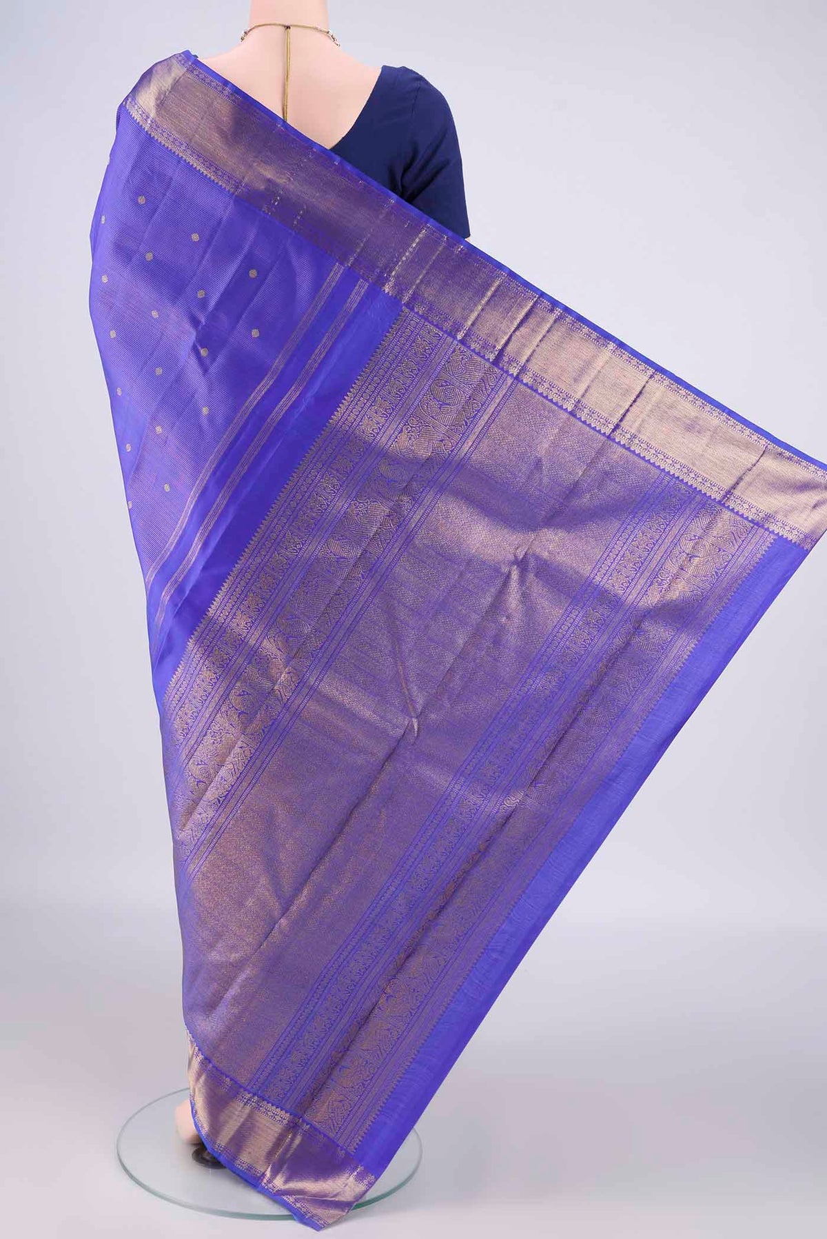 Flat view of Pure Silk Pure Zari Royal Blue Kanjivaram Saree with Zari Butta on the body and Zari Border. 