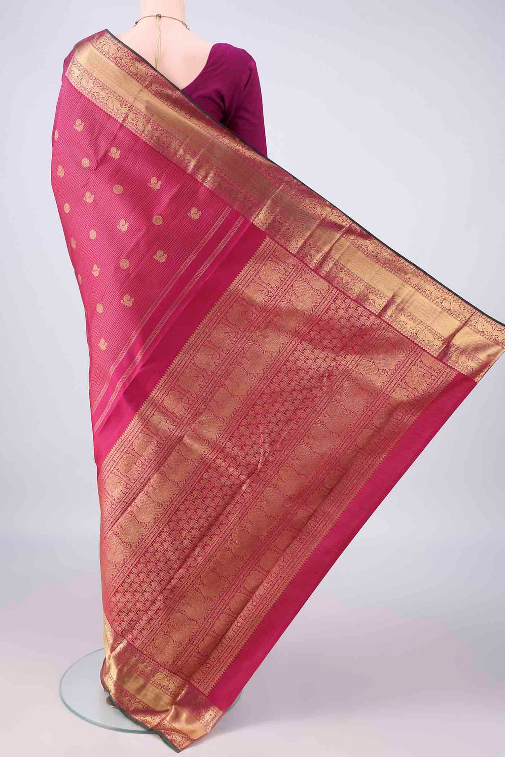 Flat view of Pure Silk Pure Zari Dark Pink Kanjivaram Saree with Checked design on the body and Zari Border. 
