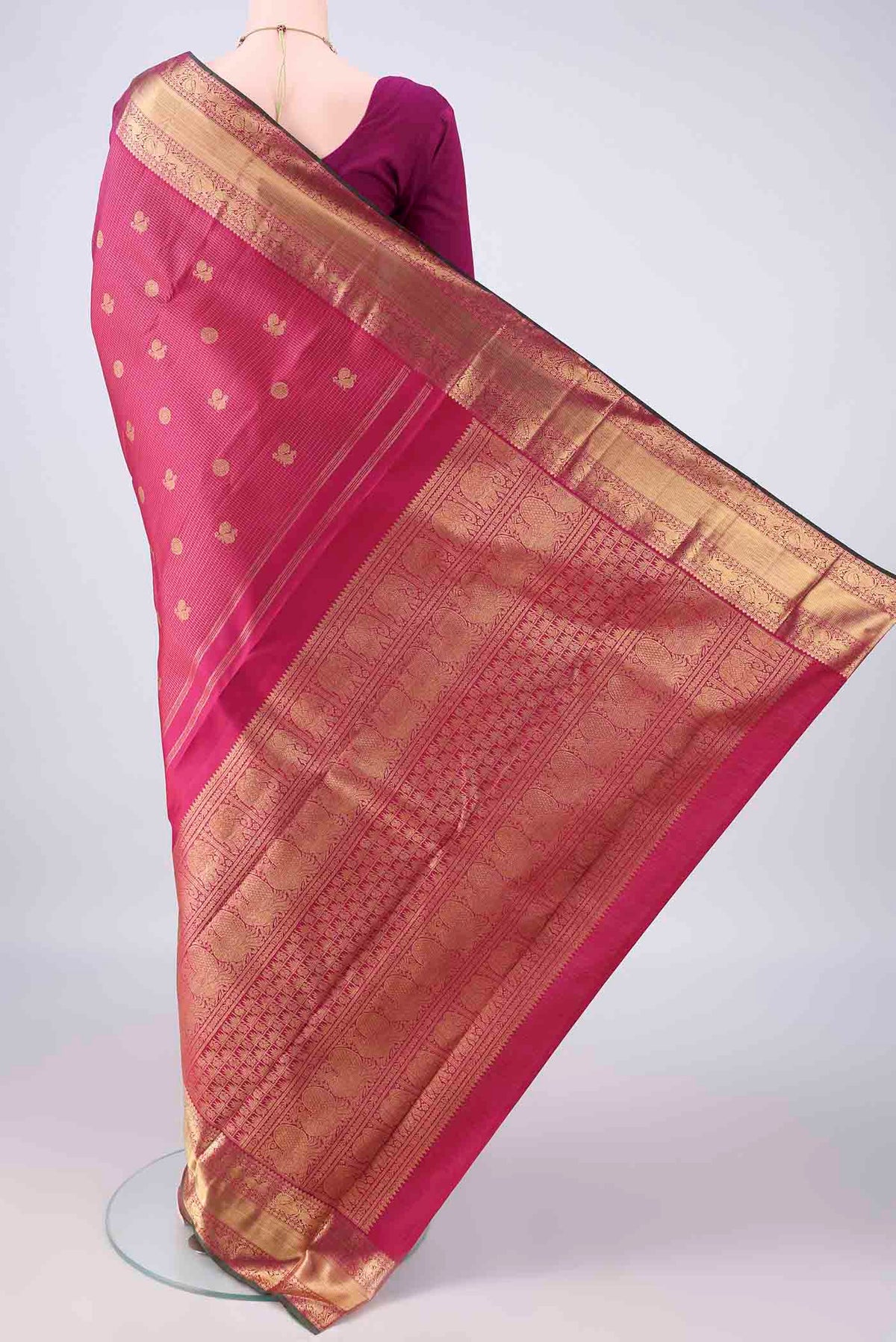 Flat view of Pure Silk Pure Zari Dark Pink Kanjivaram Saree with Checked design on the body and Zari Border. 