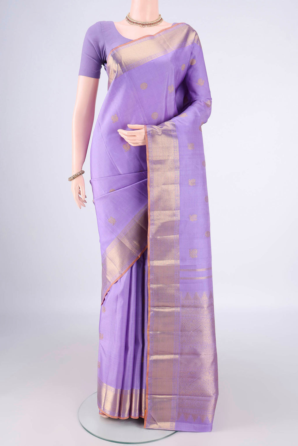 Pure Silk Pure Zari Lavender Kanjivaram Saree with Zari Butta on the body and Zari Border.  displayed on a mannequin