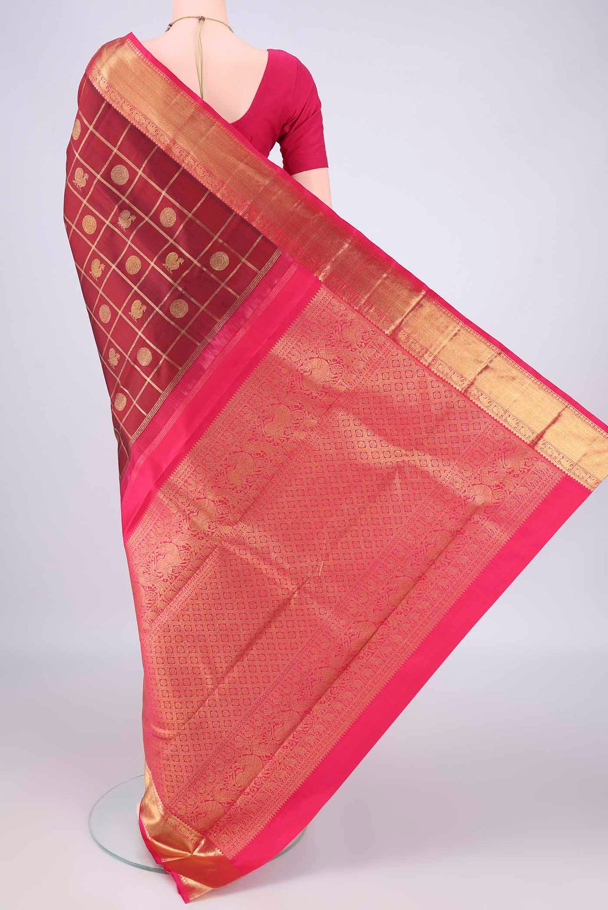 Flat view of Pure Silk Maroon Kanjivaram Saree with Checked design on the body and Zari Border. 