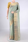 Pure Silk Pure Zari Pista Green Kanjivaram Saree with Checked design on the body and Zari Border.  displayed on a mannequin