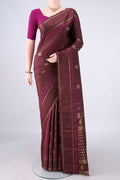 Pure Silk Brown Kanchipuram Saree with Zari Butta on the body and Plain Border.  displayed on a mannequin