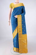 Pure Silk Blue Kanjivaram Saree with Zari Butta on the body and Zari Border.  displayed on a mannequin