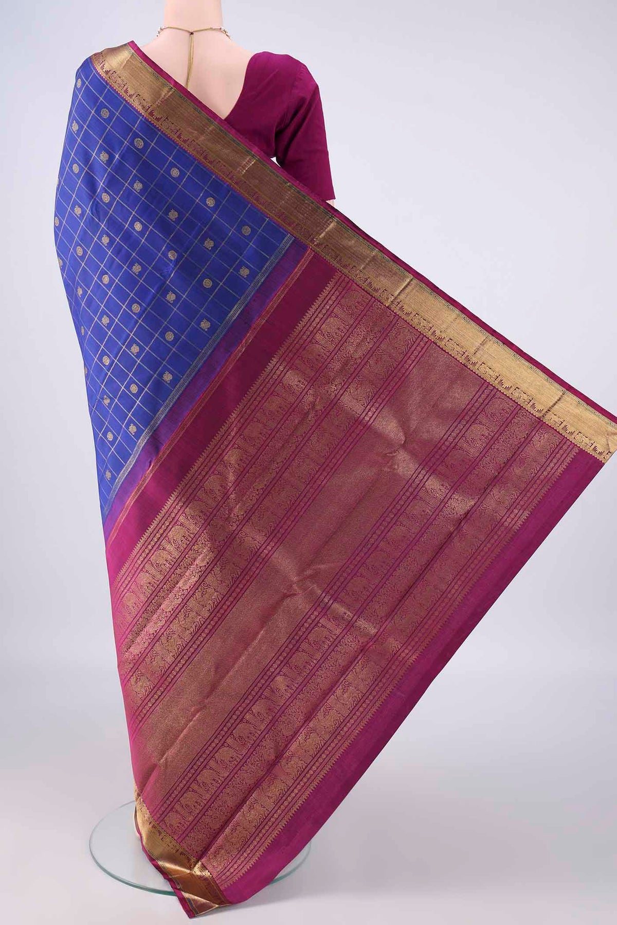 Flat view of Pure Silk Pure Zari Royal Blue Kanjivaram Saree with Checked design on the body and Zari Border. 
