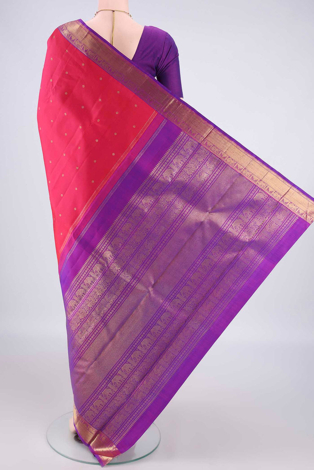 Flat view of Pure Silk Pure Zari Dark Pink Kanjivaram Saree with Zari Butta on the body and Zari Border. 