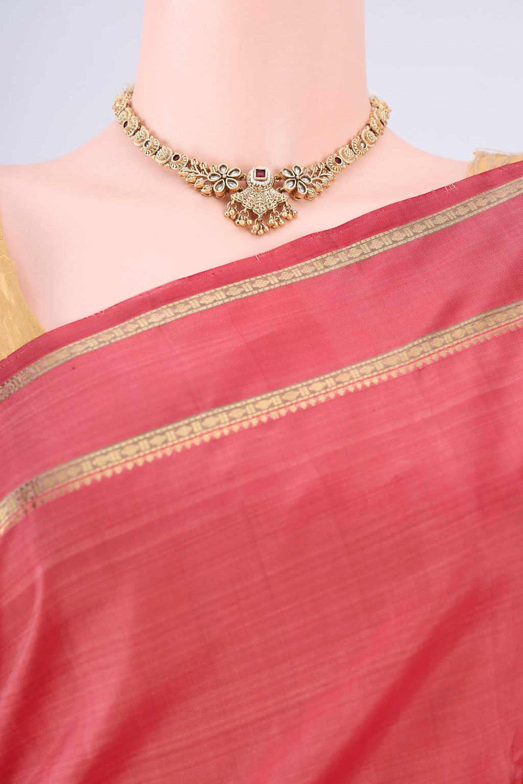 Border image of Pure Silk Pure Zari Coral Kanchipuram Saree with Zari Butta on the body and Zari Border. 