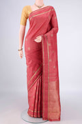 Pure Silk Pure Zari Coral Kanchipuram Saree with Zari Butta on the body and Zari Border.  displayed on a mannequin