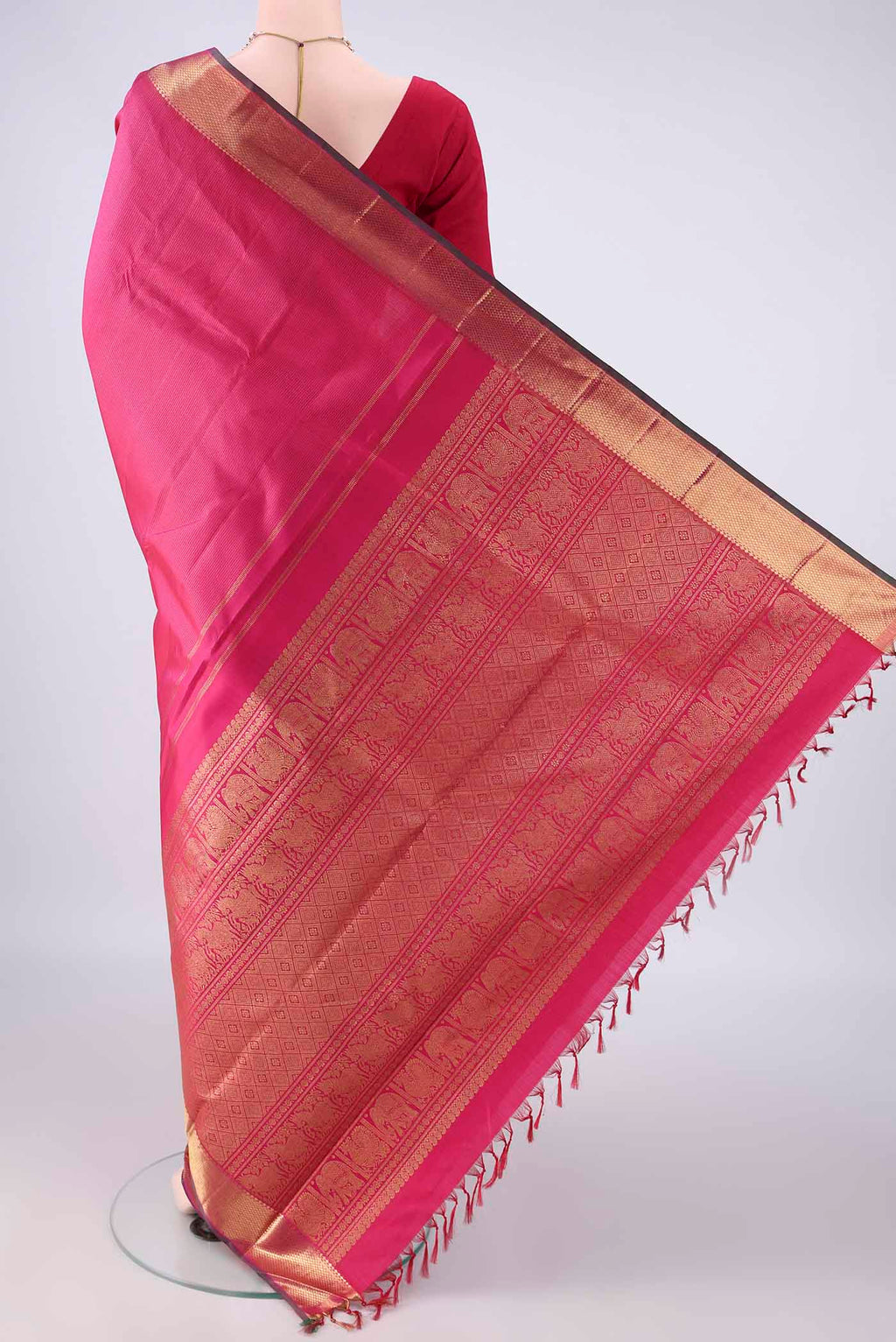 Flat view of Pure Silk Pure Zari Pink Kanjivaram Saree with Stripes on the body and Zari Border. 