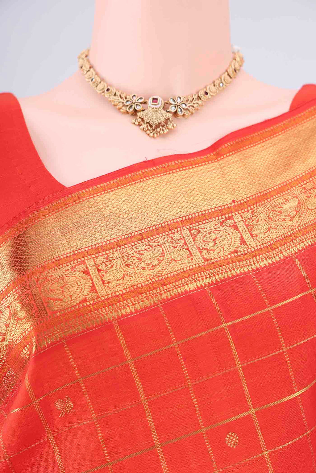 Border image of Pure Silk Pure Zari Orange Kanjivaram Saree with Checked design on the body and Zari Border. 