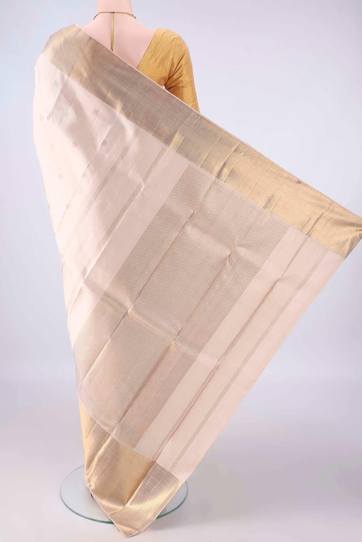 Flat view of Pure Silk Beige Dual Tone Kanchipuram Saree with Zari Butta on the body and Zari Border. 