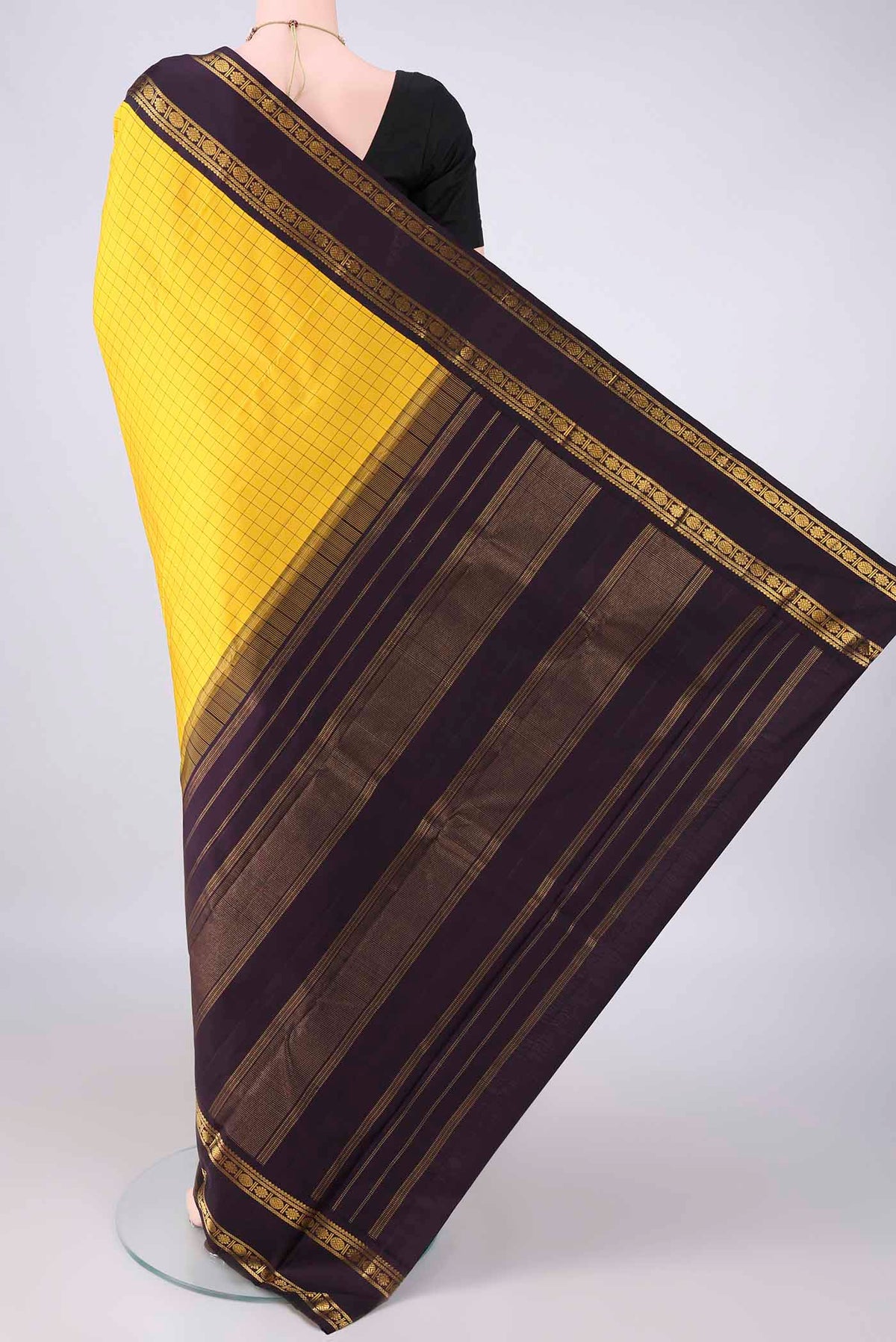 Flat view of Pure Silk Pure Zari Yellow Kanjivaram Saree with Checked design on the body and Plain Border. 