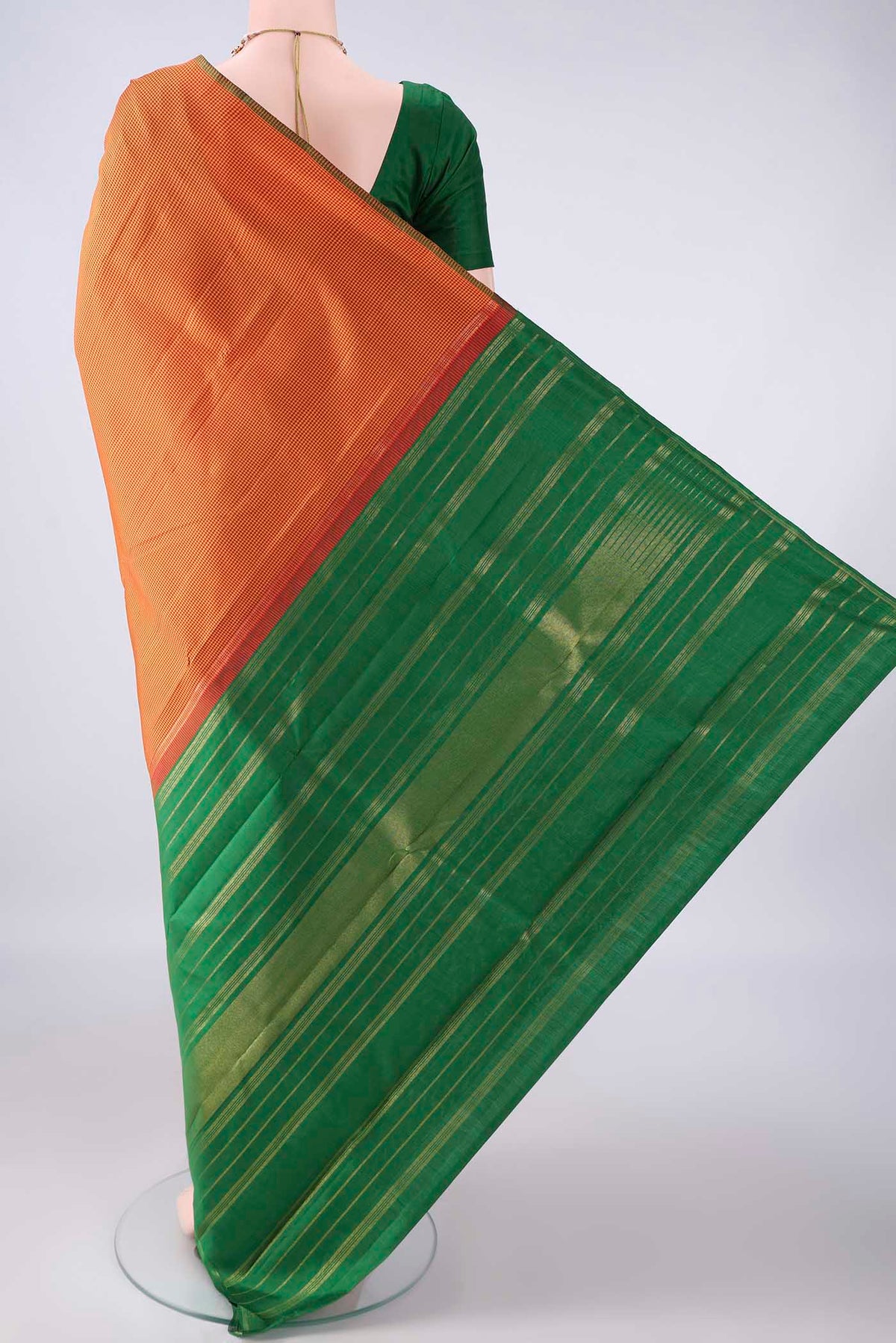 Flat view of Pure Silk Brick Orange Kanjivaram Saree with Checked design on the body and Without Border. 