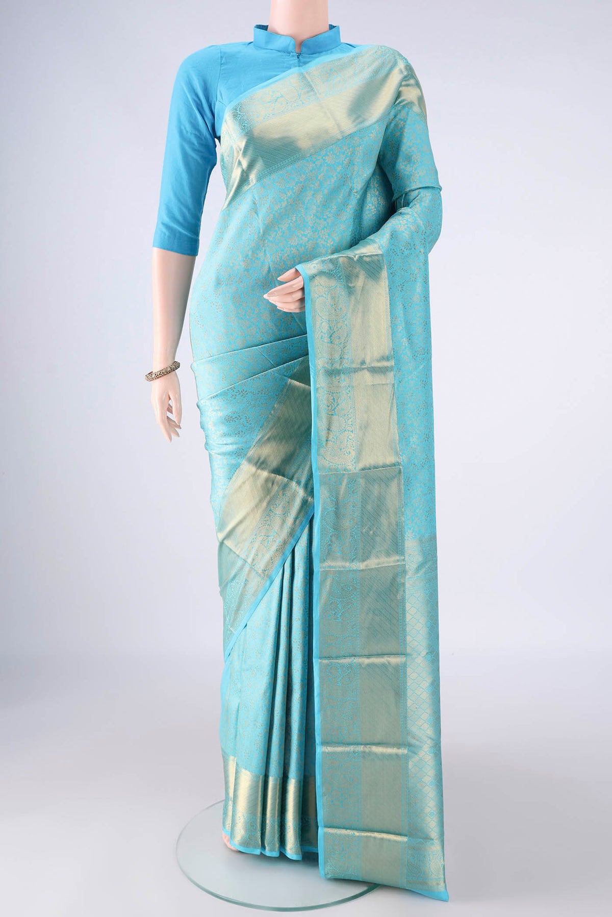 Pure Silk Sky Blue Kanjivaram Saree with Zari Brocade on the body and Zari Border.  displayed on a mannequin