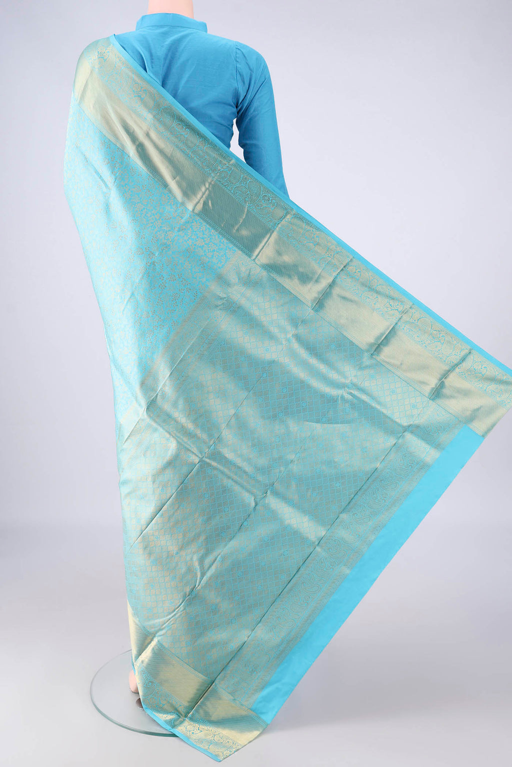 Flat view of Pure Silk Sky Blue Kanjivaram Saree with Zari Brocade on the body and Zari Border. 