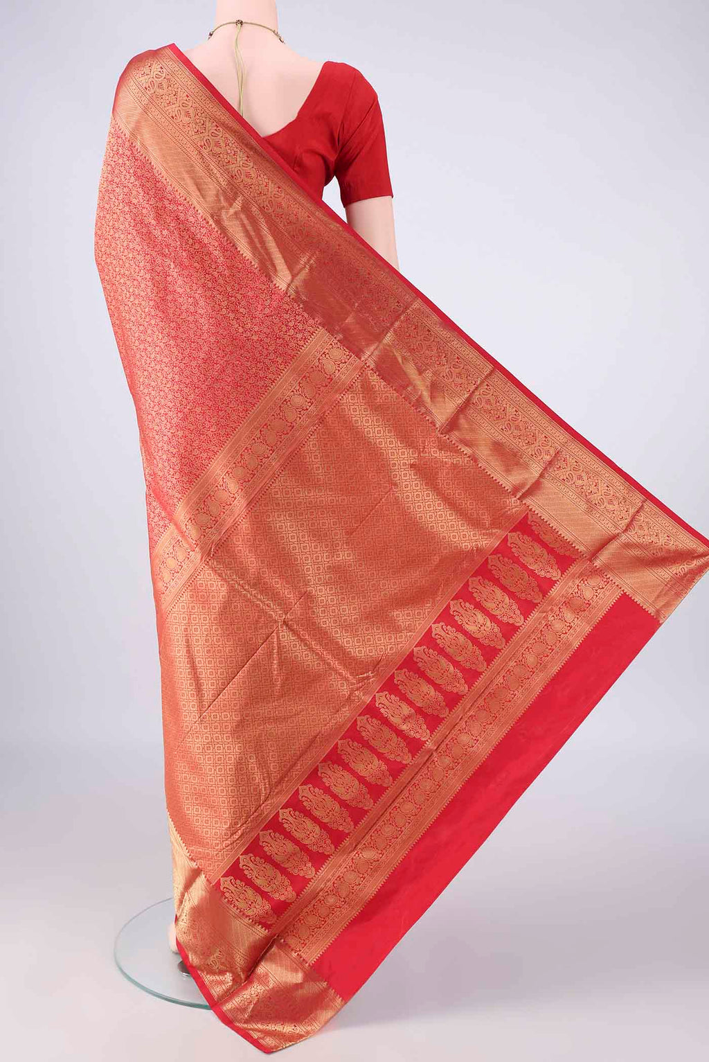Flat view of Pure Silk Red Kanjivaram Saree with Zari Brocade on the body and Zari Border. 