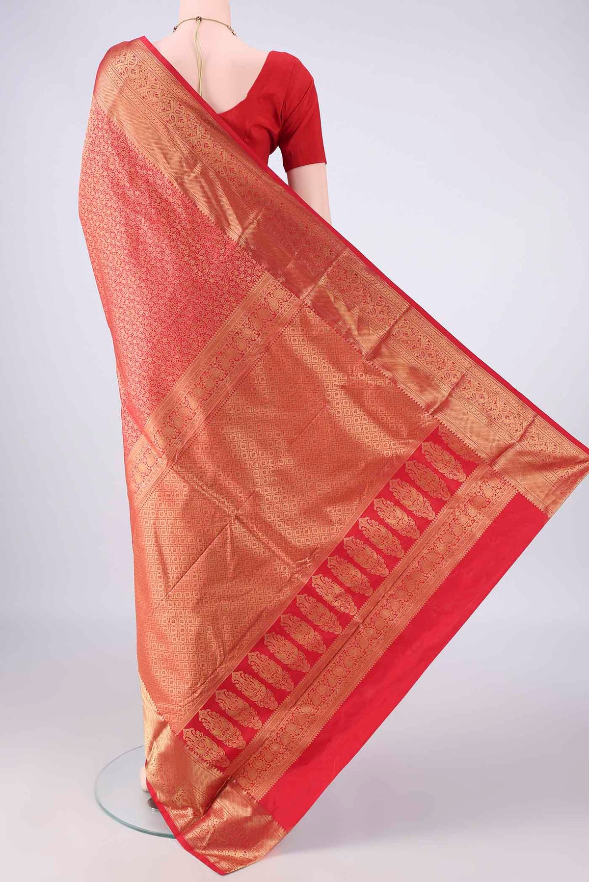 Flat view of Pure Silk Red Kanjivaram Saree with Zari Brocade on the body and Zari Border. 