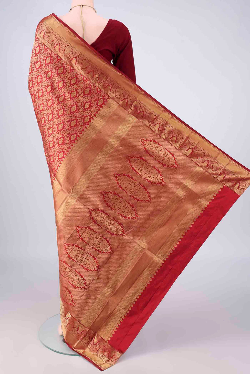 Flat view of Pure Silk Maroon Kanjivaram Saree with Zari Brocade on the body and Zari Border. 