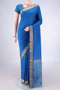 Blue Blended Bangalore Silk Saree with Jacquard design on the body and Zari Border.  displayed on a mannequin