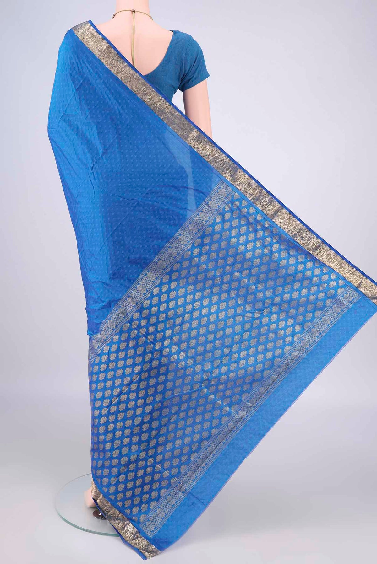 Flat view of Blue Blended Bangalore Silk Saree with Jacquard design on the body and Zari Border. 