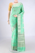 Pure Silk Mint Green Banarasi Raw Saree with Zari Butta on the body and Zari Border.  displayed on a mannequin