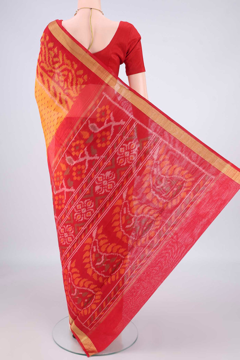 Flat view of Mustard Silk Cotton Saree with Ikat Print on the body and Ikat Border. 