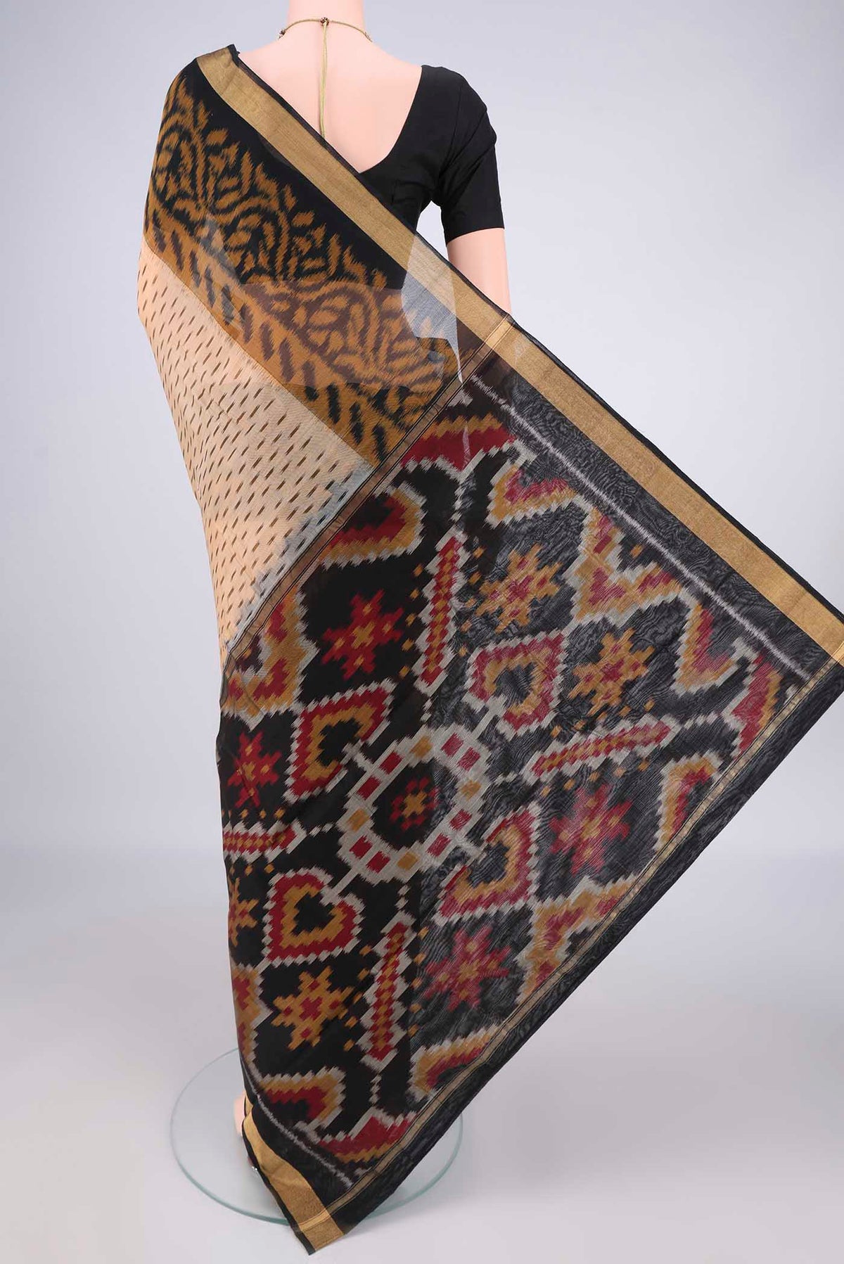 Flat view of Dark Beige Silk Cotton Saree with Ikat Print on the body and Zari Border. 