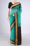 Sea Green Silk Cotton Saree with Ikat Print on the body and Zari Border.  displayed on a mannequin
