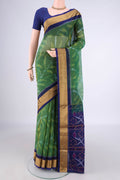 Green Silk Cotton Saree with Ikat Print on the body and Zari Border.  displayed on a mannequin