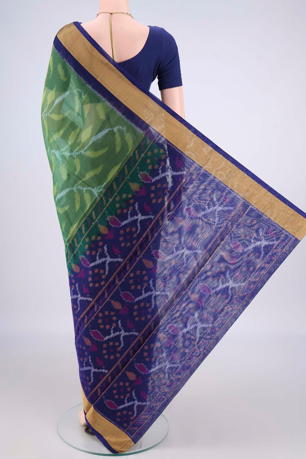 Flat view of Green Silk Cotton Saree with Ikat Print on the body and Zari Border. 