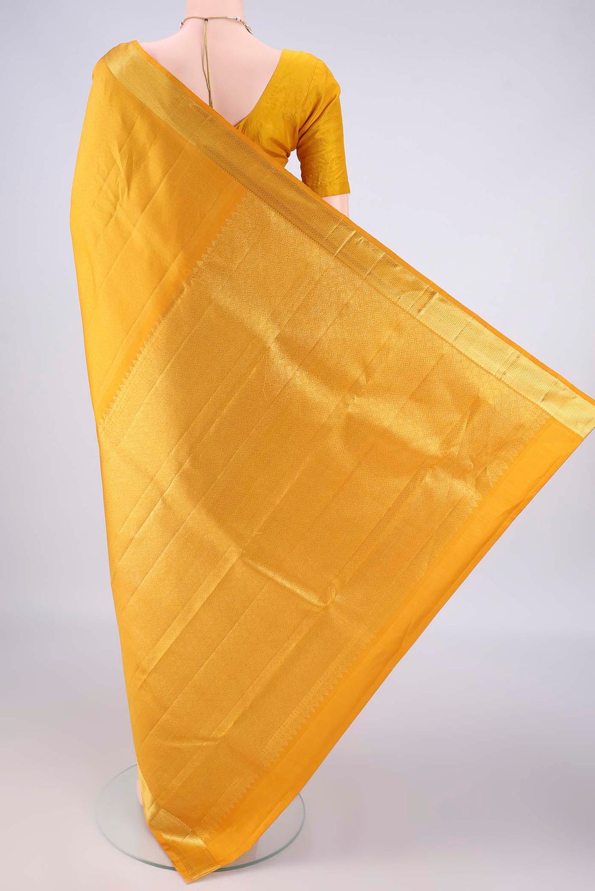 Flat view of Mustard Kanchipuram Tissue Saree with Stripes on the body and Zari Border. 