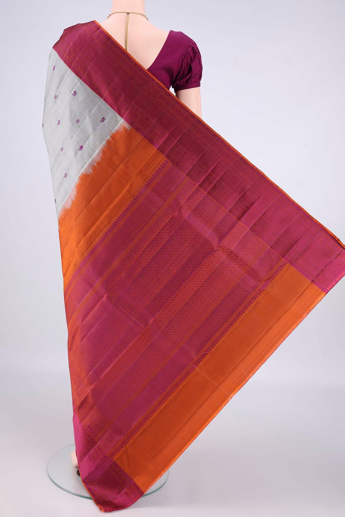 Flat view of Pure Silk Grey Kanchipuram Saree with Thread Butta on the body and Thread Border. 