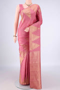 Pure Silk Pink Kanjivaram Saree with Zari Butta on the body and Temple Border.  displayed on a mannequin