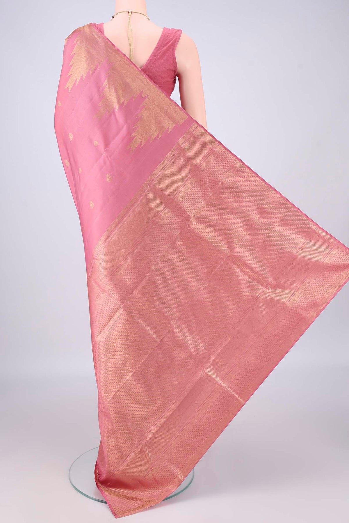 Flat view of Pure Silk Pink Kanjivaram Saree with Zari Butta on the body and Temple Border. 