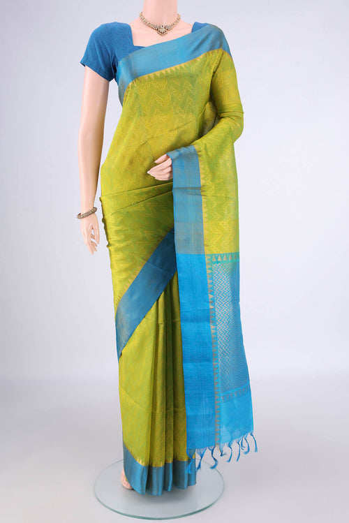 Acid Green Coimbatore Cotton Saree with Jacquard design on the body and Zari Border.  displayed on a mannequin