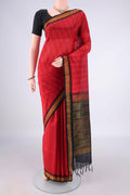 Red Coimbatore Cotton Saree with Checked design on the body and Zari Border.  displayed on a mannequin