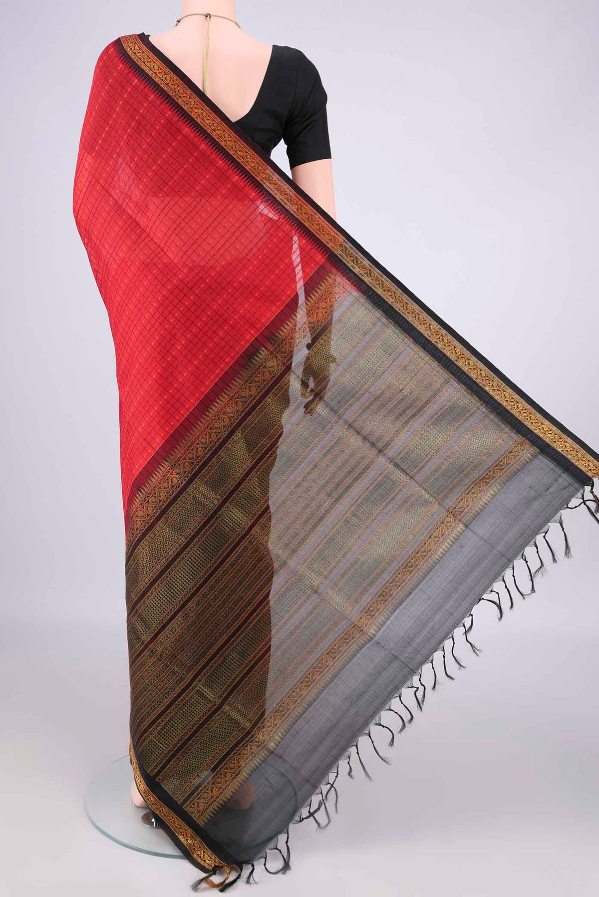 Flat view of Red Coimbatore Cotton Saree with Checked design on the body and Zari Border. 