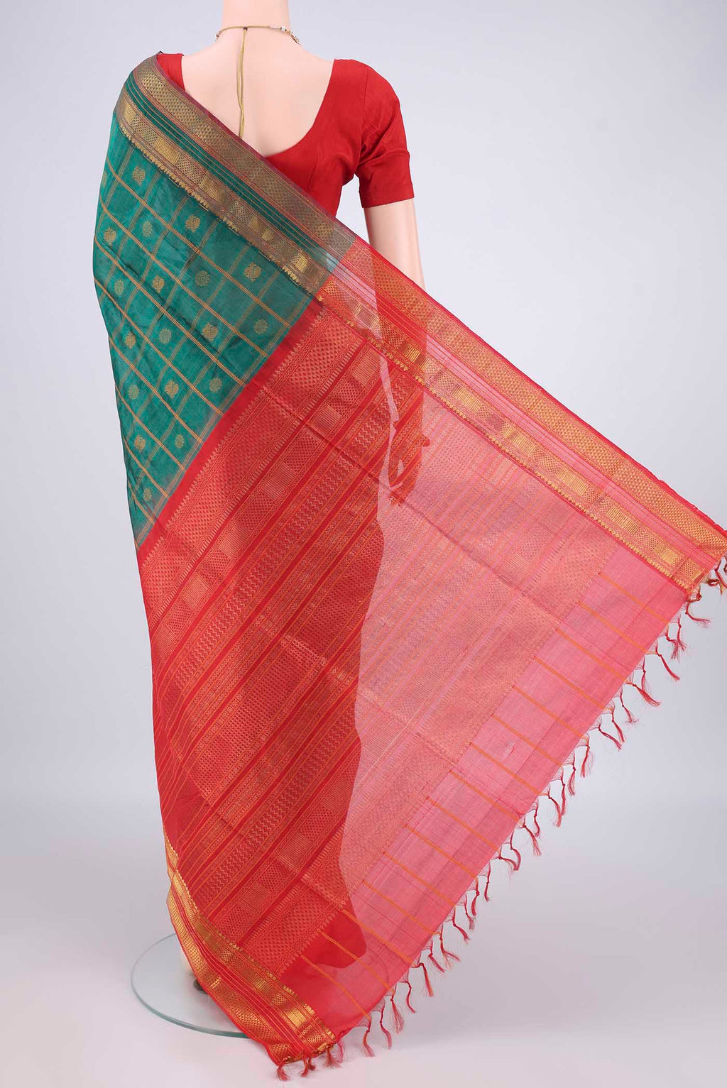 Flat view of Green Coimbatore Cotton Saree with Checked design on the body and Zari Border. 