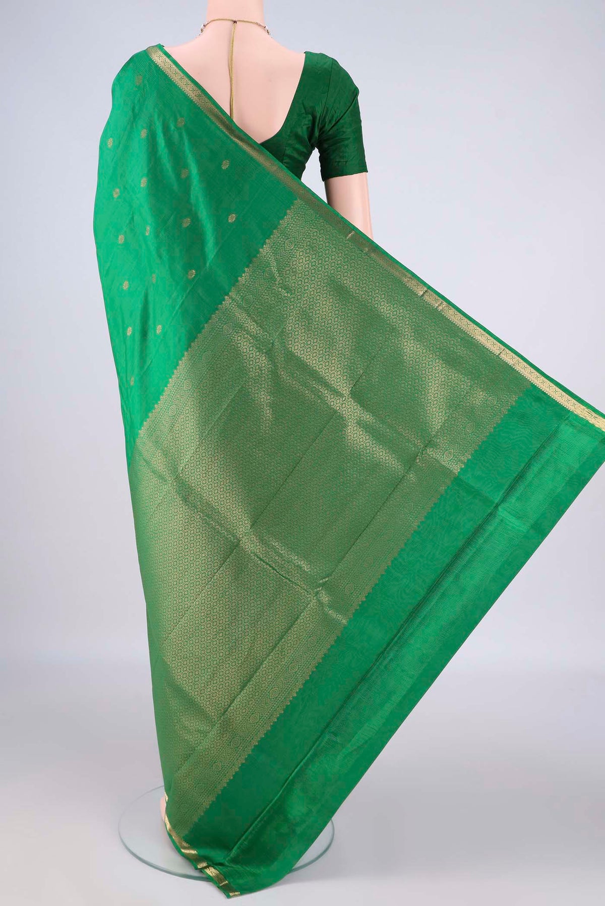 Flat view of Pure Silk Green Kanjivaram Saree with Zari Butta on the body and Zari Border. 