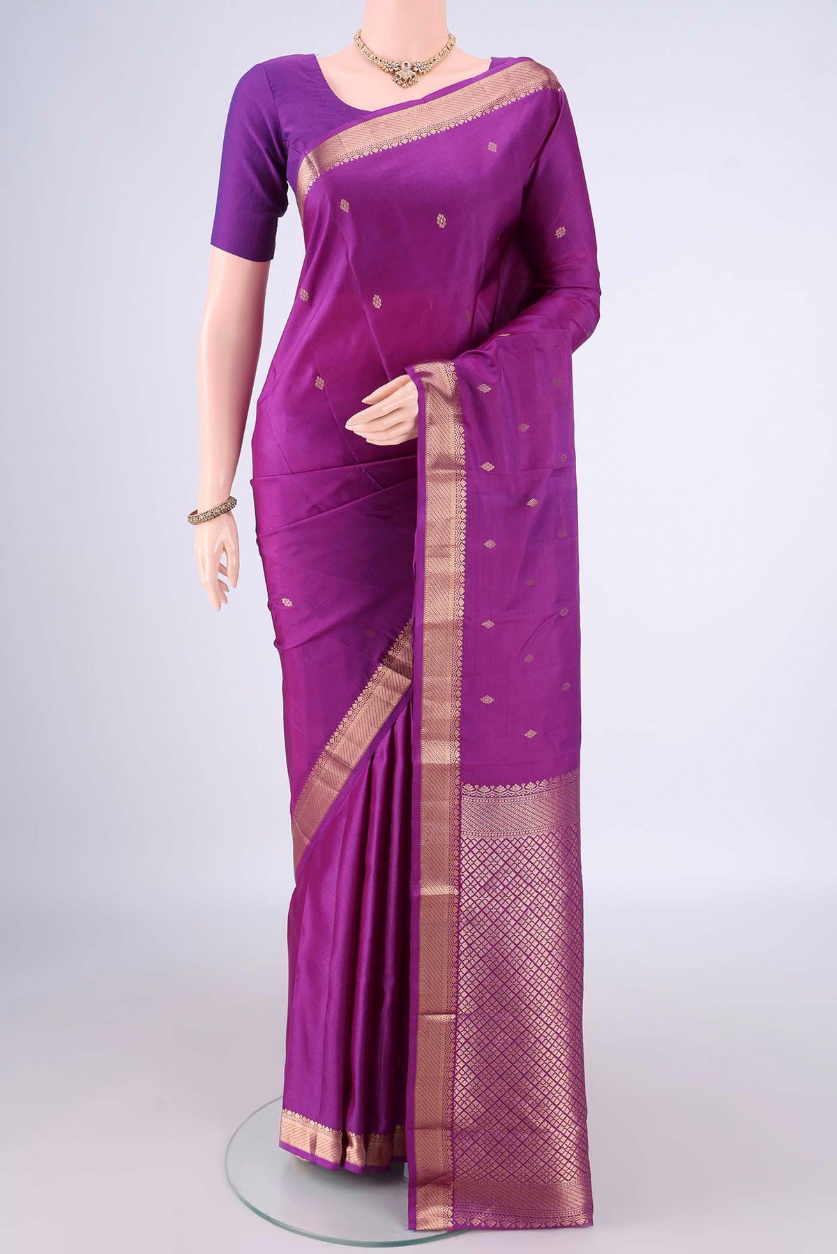 Pure Silk Light Magenta Kanjivaram Saree with Zari Butta on the body and Zari Border.  displayed on a mannequin