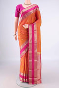 Pure Silk Pinkish Yellow Kanchipuram Saree with Zari Butta on the body and Zari Border.  displayed on a mannequin