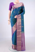 Pure Silk Peacock Blue Dual Tone Kanchipuram Saree with Zari Butta on the body and Zari Border.  displayed on a mannequin