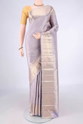 Pure Silk Lilac Kanchipuram Saree with Zari Brocade on the body and Zari Border.  displayed on a mannequin