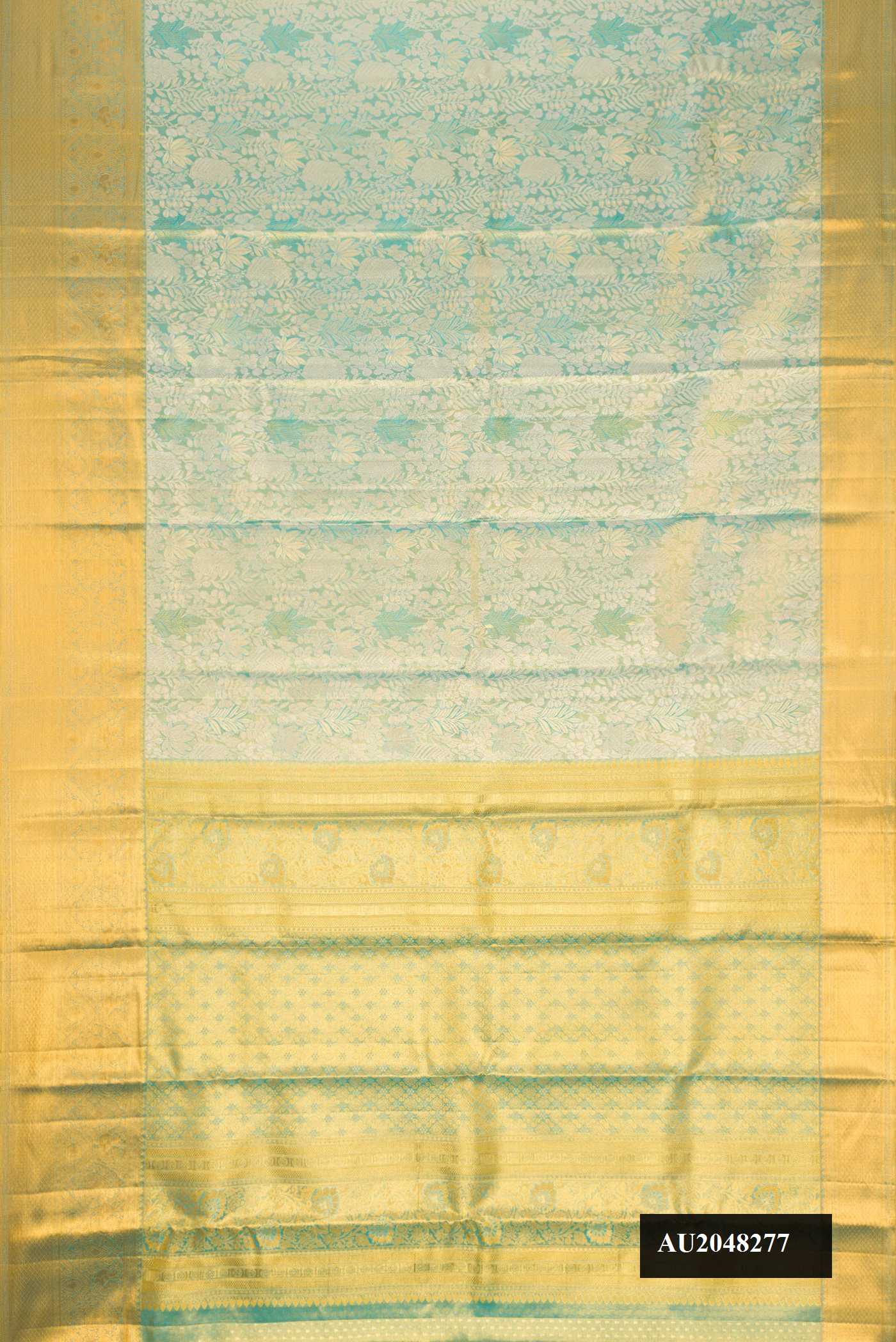 Light Blue Dual Tone Kanchipuram Tissue Silk Saree with Zari Brocade on the body and Zari Border.  displayed on a mannequin