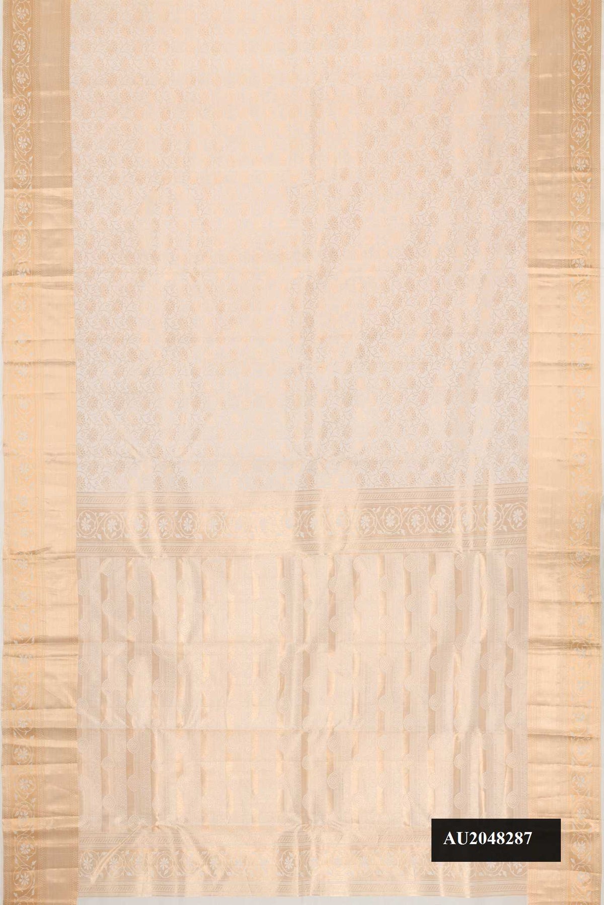 Off White Dual Tone Kanchipuram Silk Saree with Zari Brocade on the body and Zari Border.  displayed on a mannequin