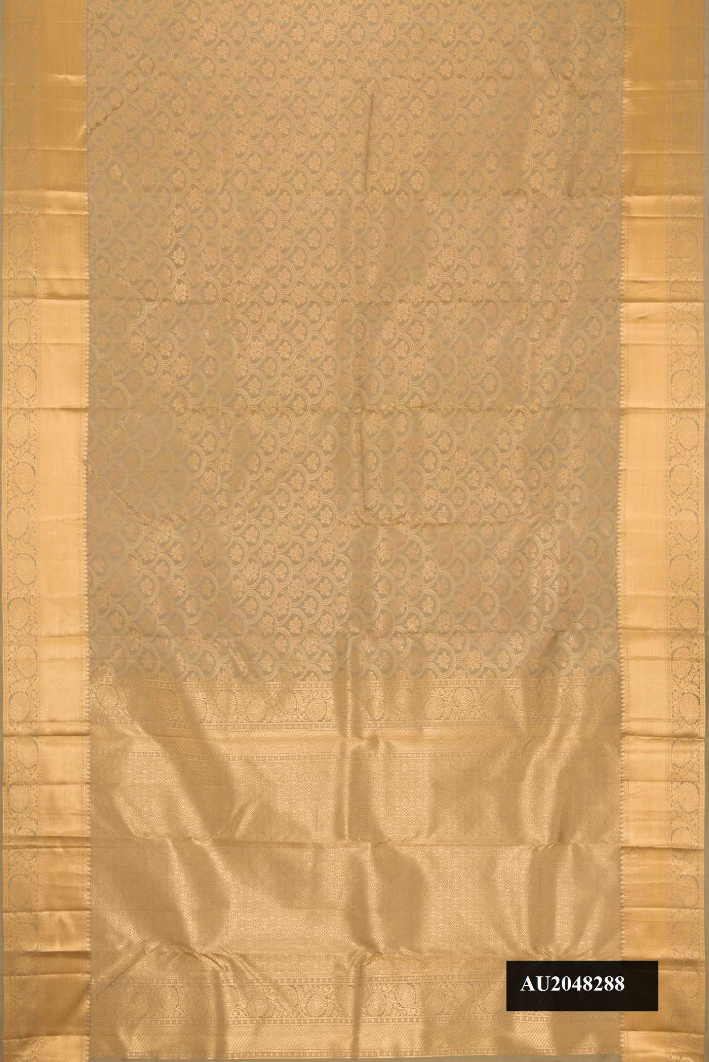 Caramel Dual Tone Kanchipuram Silk Saree with Zari Brocade on the body and Zari Border.  displayed on a mannequin