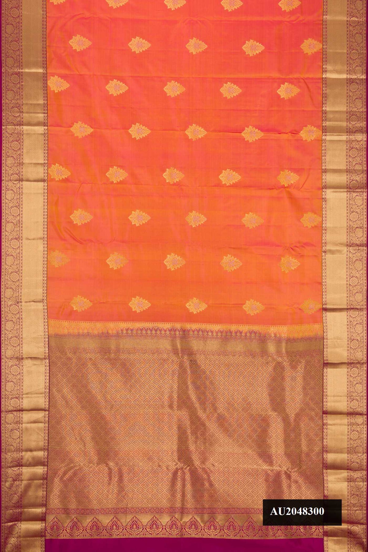 Coral Dual Tone Kanchipuram Silk Saree with Zari Butta on the body and Zari Border.  displayed on a mannequin