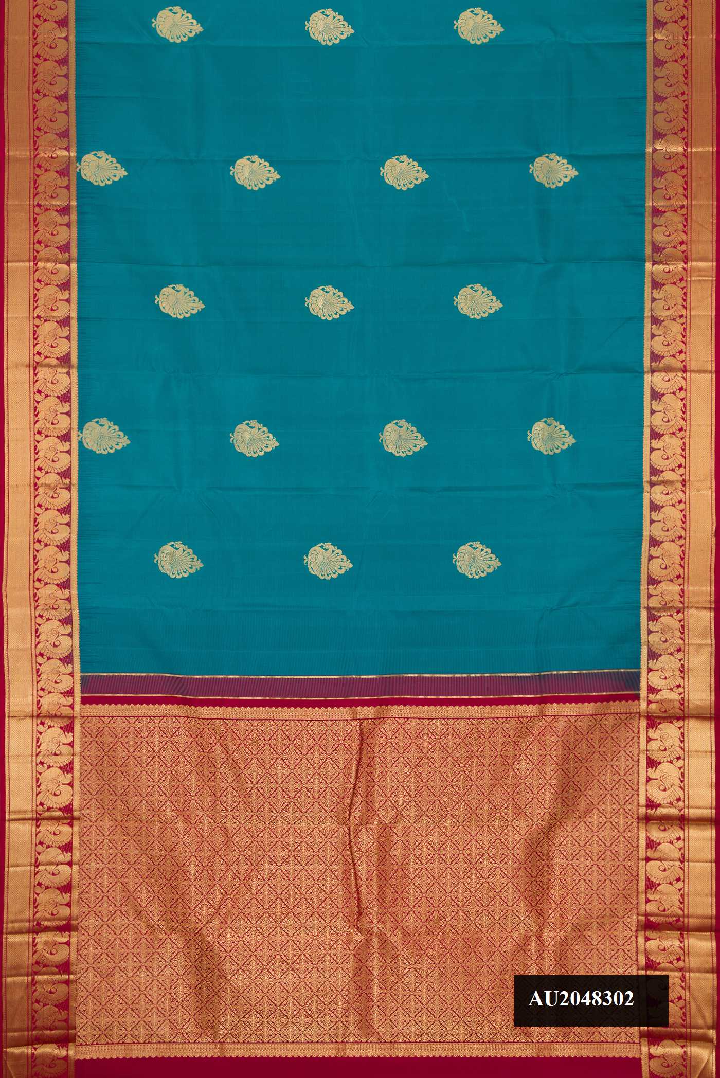Peacock Blue Dual Tone Kanchipuram Silk Saree with Zari Butta on the body and Zari Border.  displayed on a mannequin