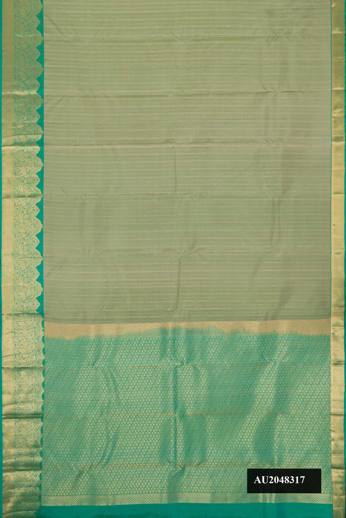 Pista Green Dual Tone Kanchipuram Silk Saree with Zari Butta on the body and Fancy Border.  displayed on a mannequin